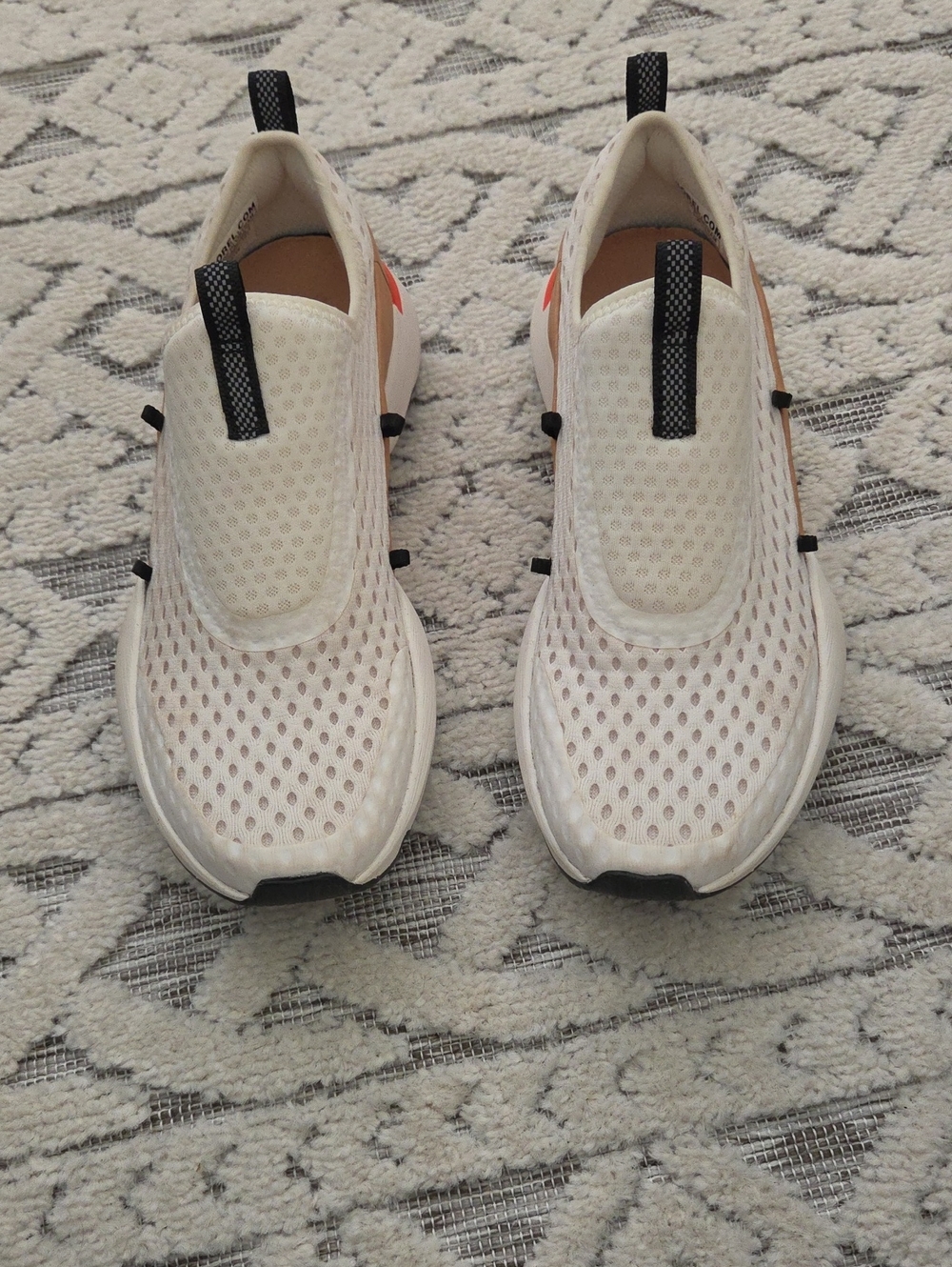 Sorel Slip-On Sneakers in White and Tan with Black Logo
